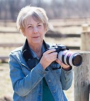 Jeanne Garrett with camera and favorite lens
