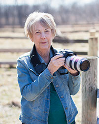 Jeanne Garrett with camera and favorite lens